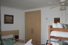 Bedroom bed bunk and cupboard